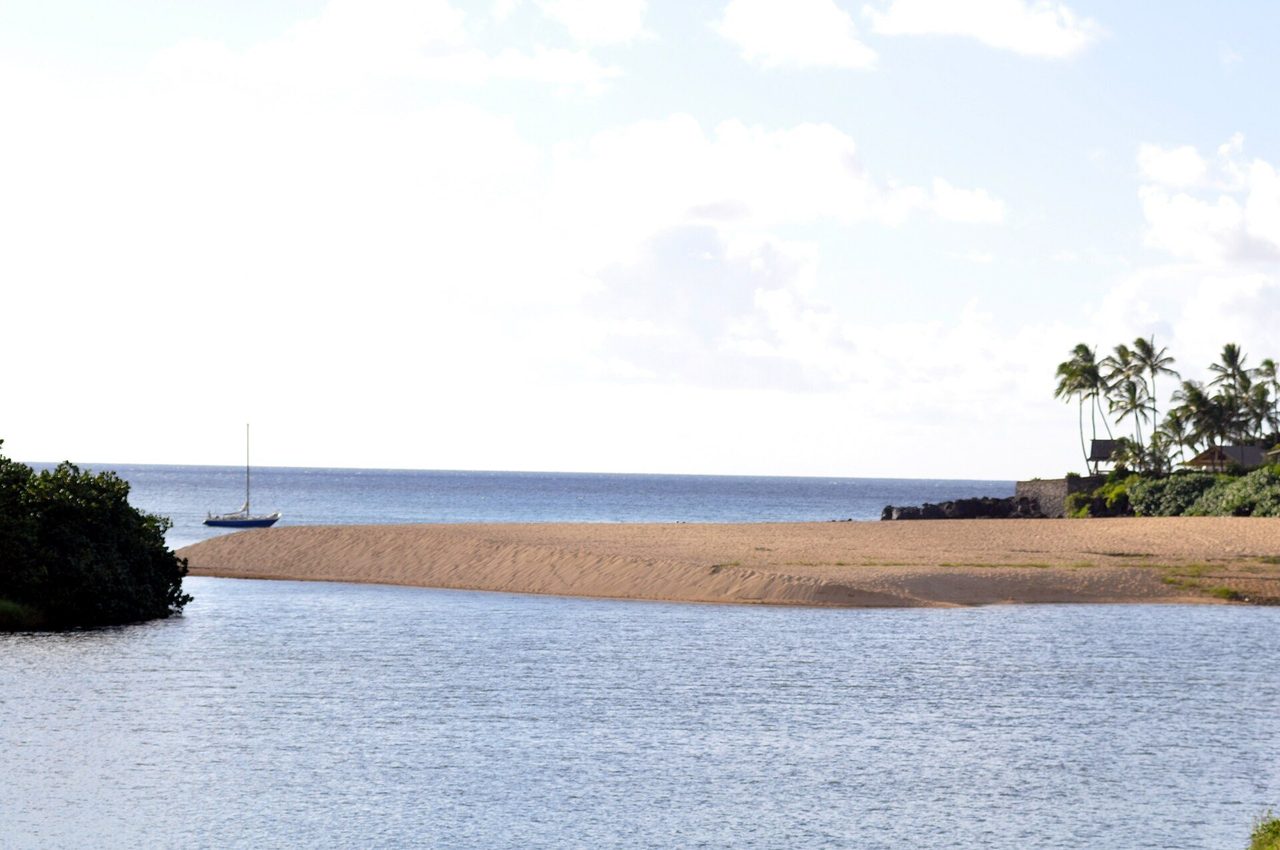Waimea Bay's sandy beach and calm water on Oahu's North Shore