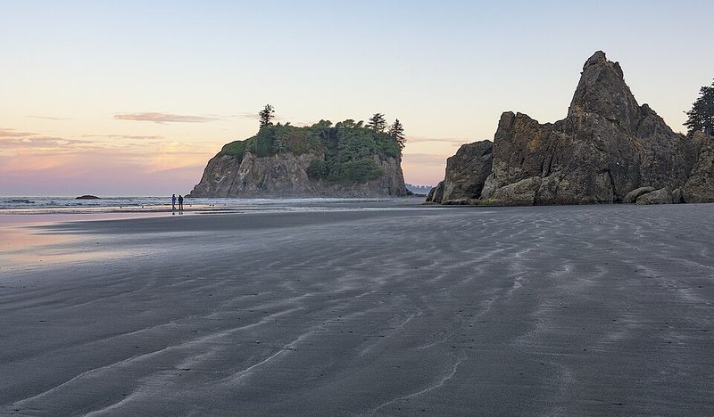 Sea stacks at Ruby Beach at dusk with ripples in the wet sand at low tide