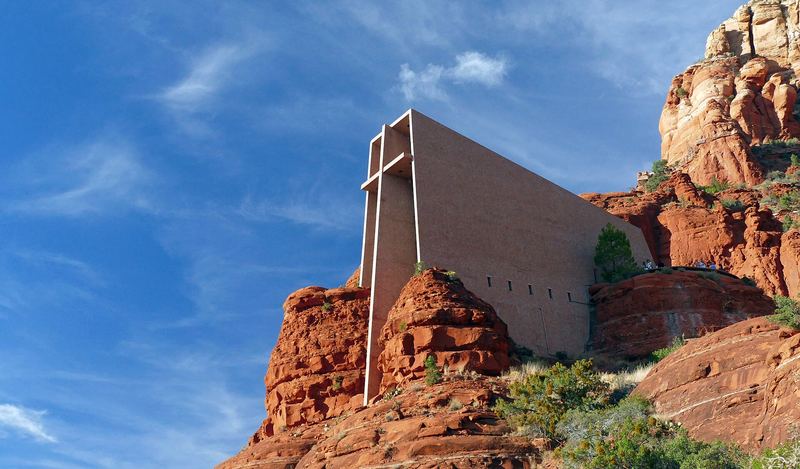 The Chapel of the Holy Cross built into red sandstone buttes along SR 179.